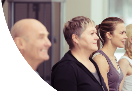 A group of people exercising together in a gym.